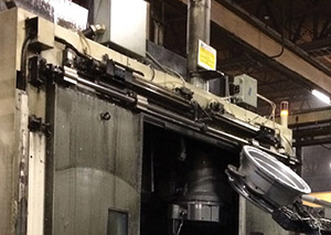 Pneumatically-operated doors in wheel manufacturing were causing bottlenecks and damage, as their opening and closing times were too slow for the robots working with them.
