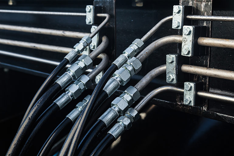 Figure 3. Having all hydraulic hose or steel tube in a high-pressure hydraulic system is a recipe for noise. Using a combination of steel tube with hose reduces cyclical radial expansion over a long hose but also isolates the tube from direct machine vibrations.