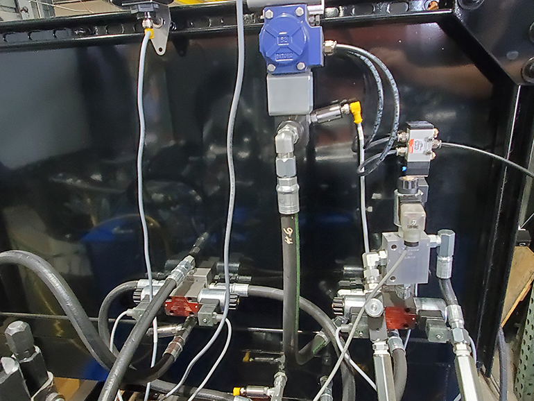The system Power Drives Inc. built used JIC fittings, various tees and inline check valves to keep the pressure from going backward. Hoses on the design included two wire-braided hoses rated for 5,000 psi and 4 wire spiral hose in high impulse application.