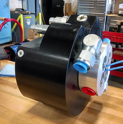 A custom rotary union designed by Turner Hydraulics/TASCorp. features four ports of hydraulic fluid transmission — a pressure line, tank line, drain or pilot operating line, and second pressure or tank line. | Courtesy of Turner Hydraulics/TASCorp.
